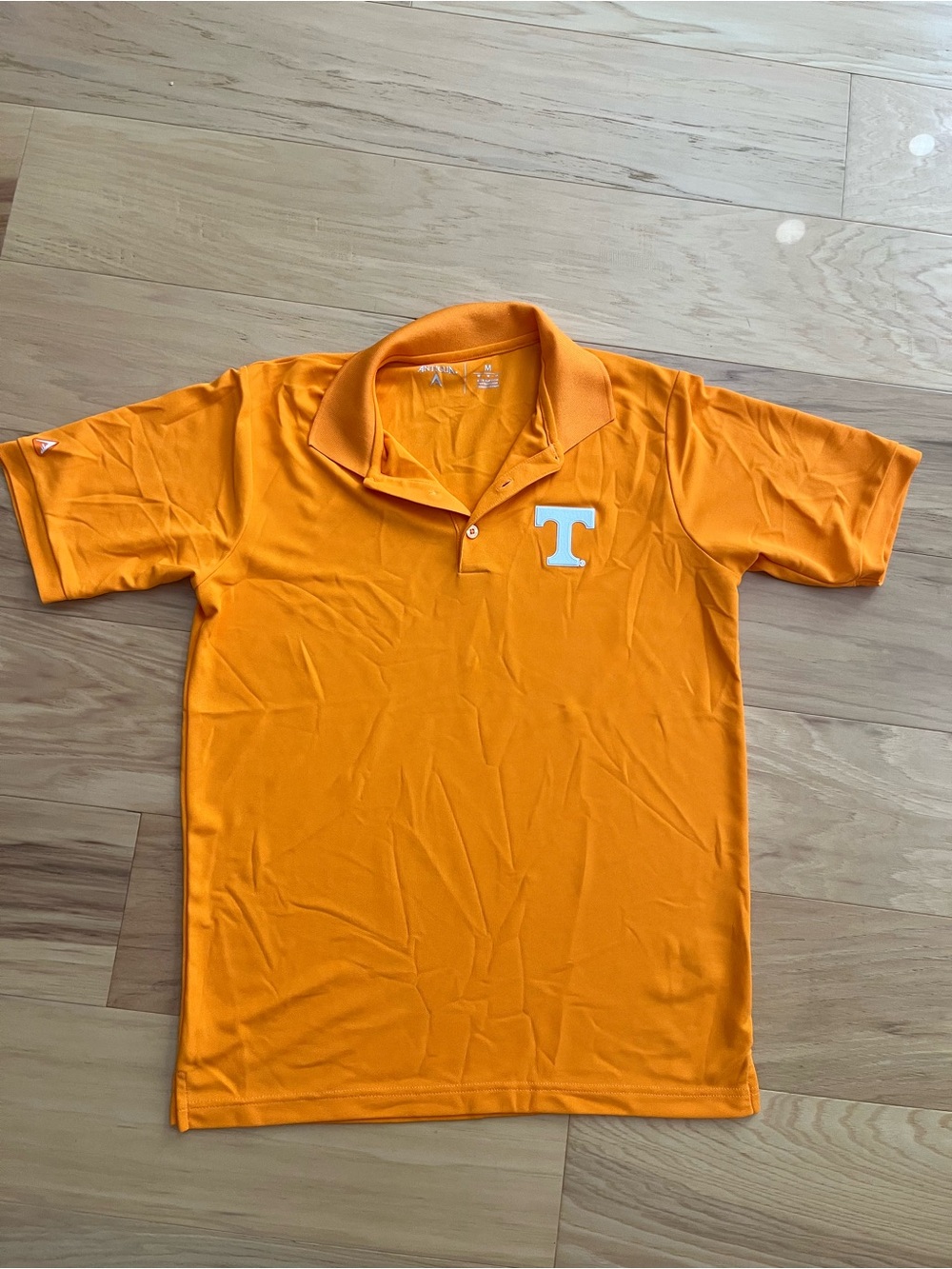 Antigua Orange Polo with White 'T' Chest Emblem